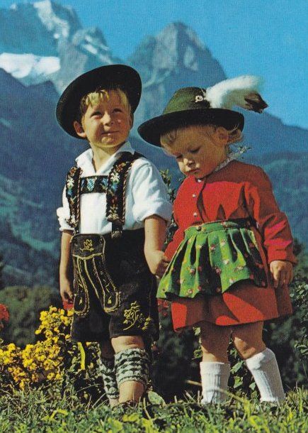 Vintage photograph of two children in traditional Alpine dress