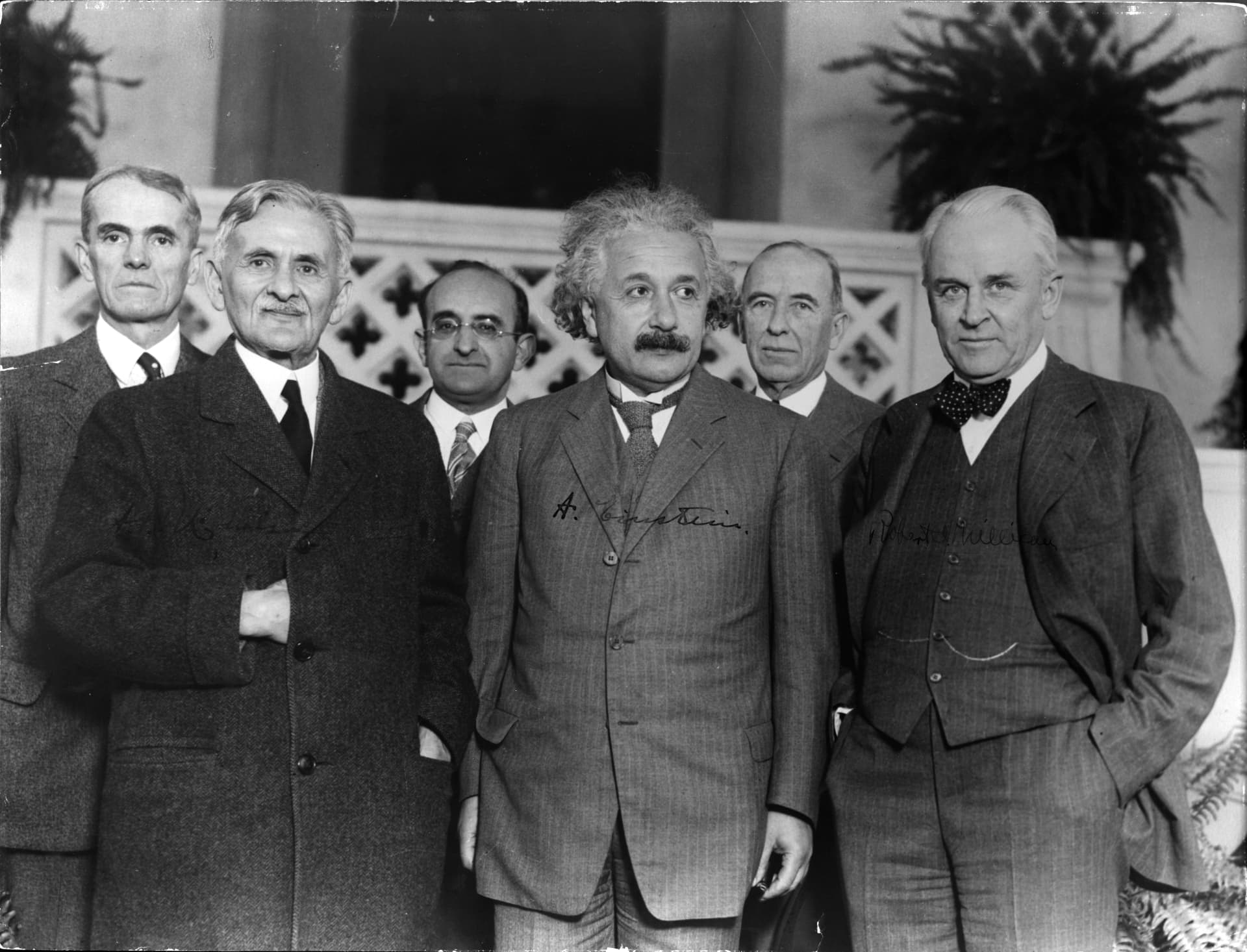 Black and white group portrait of Albert Einstein with colleagues
